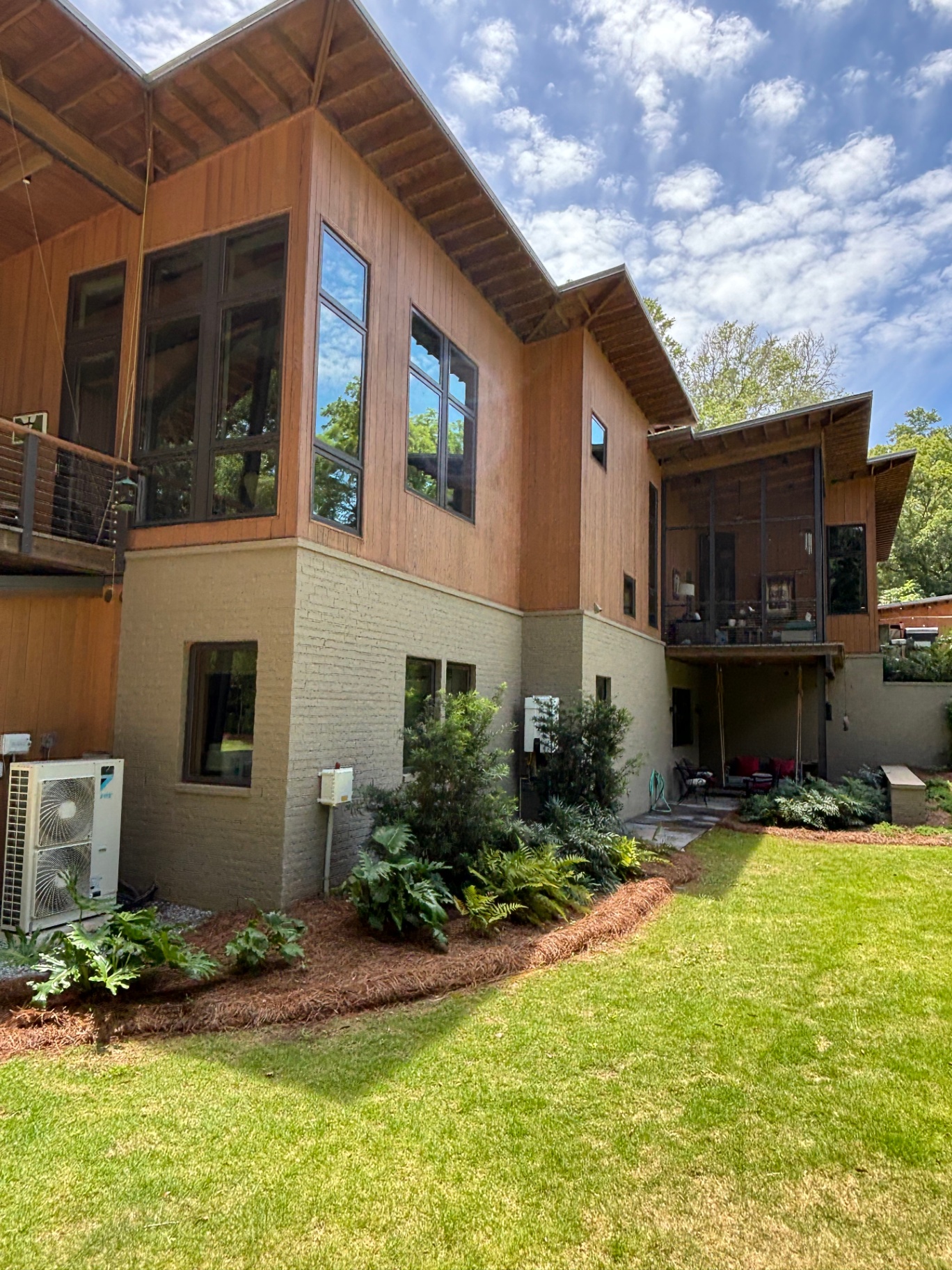 Freshly cleaned home exterior with a green lawn