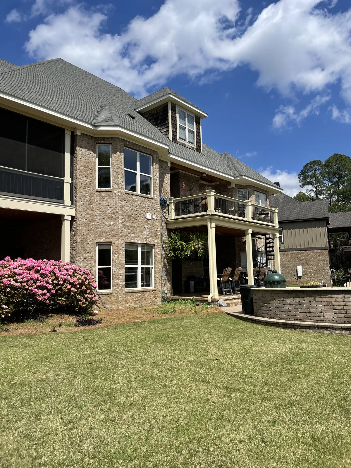 After: exterior windows cleaned on a brick and siding home under the oaks in Spanish Fort, AL