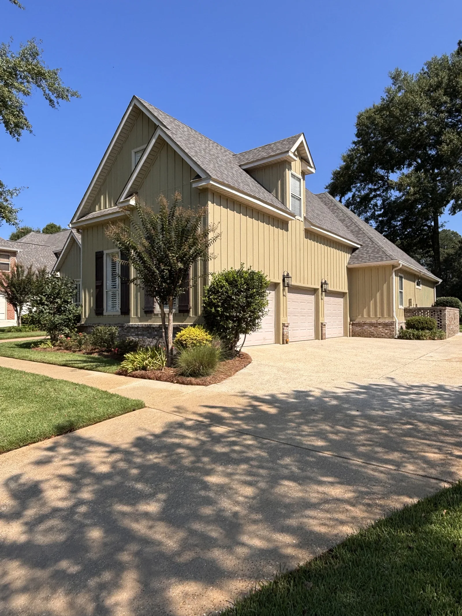 After: surface-cleaned driveway in Spanish Fort, AL — concrete lightened evenly